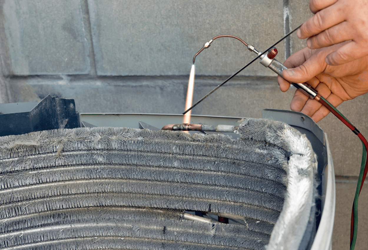 A picture of cleaning A/C coils.